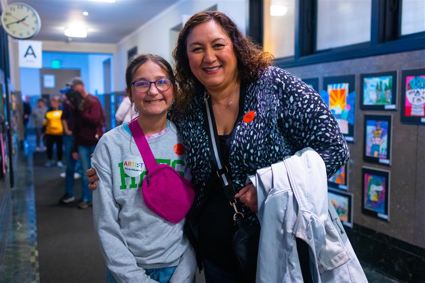 Students and their family at an art show